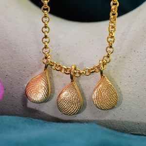 Three Family Dainty Raindrop Fingerprint Necklaces in solid 18ct gold | Necklace for Mum | Children's Fingerprints | Displayed on an 18ct gold belcher or rolo chain | Custom engraving on reverse | Personalised Necklace | Sophia Alexander Fingerprint Jewellery | Handmade in Suffolk UK