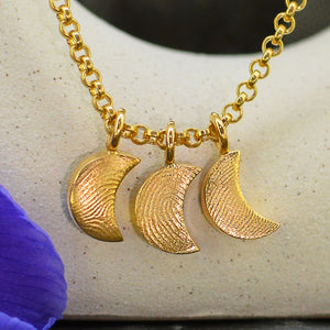 Three Family Dainty Moon Fingerprint Necklaces in solid 18ct gold | Necklace for Mum | Children's Fingerprints | Displayed on an 18ct gold belcher or rolo chain | Custom engraving on reverse | Personalised Necklace | Sophia Alexander Fingerprint Jewellery | Handmade in Suffolk UK