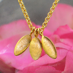 Three Family Dainty Oval Fingerprint Necklaces in solid 18ct gold | Necklace for Mum | Children's Fingerprints | Displayed on an 18ct gold belcher or rolo chain | Custom engraving on reverse | Personalised Necklace | Sophia Alexander Fingerprint Jewellery | Handmade in Suffolk UK