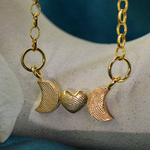 Family Fingerprint Necklace for Mum in solid 18ct gold | Heart and Moon Necklace with fingerprints from three children | Displayed on an 18ct gold belcher or rolo chain | Custom engraving on reverse | Personalised Necklace | Sophia Alexander Fingerprint Jewellery | Handmade in Suffolk UK