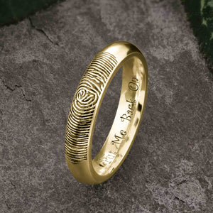 A unique Gold Wedding Ring with an engraved fingerprint on the outer surface | Engraved with a funny personal message on the inside of the ring | The engraving reads "Put Me Back On" | Contemporary dark laser engraving | Ladies slim 4mm wide, comfort court profile ring | Custom personalised wedding jewellery | Sophia Alexander Fingerprint Jewellery | Handmade in Suffolk UK