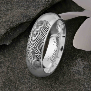 A unique platinum Wedding Ring with an engraved fingerprint on the outer surface | Engraved with a personalised handwritten message on the inside of the ring | The engraving reads "Love Lucie. x" | Contemporary Laser engraving | Mens 6mm wide, comfort court profile ring | Custom personalised wedding jewellery | Sophia Alexander Fingerprint Jewellery | Handmade in Suffolk UK