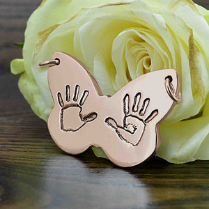 Large butterfly shaped Pendant in rose gold with two children's handprints | Personalised Gift shown on a keyring with a chain | Sophia Alexander Fingerprint Jewellery | Handmade in Suffolk UK