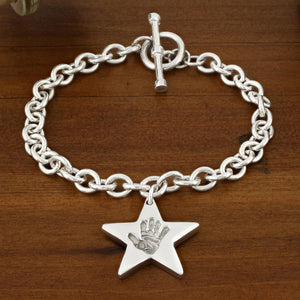 SILVER TOGGLE T-BAR BRACELET WITH HAND PRINT STAR CHARM