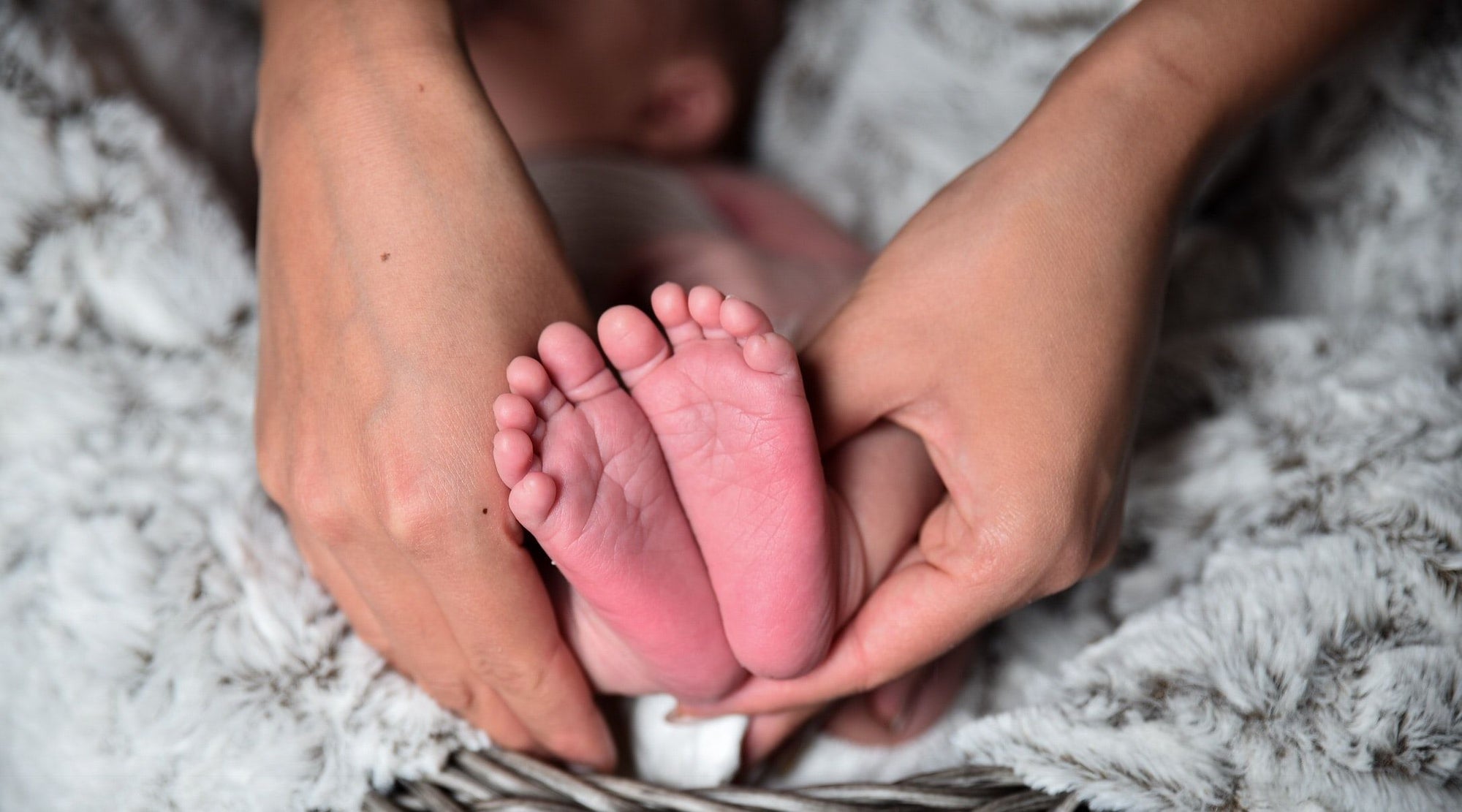 Memory Keeping for Modern Parents - Baby Feet and Mother's Hands