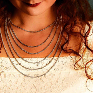 Necklace Chain Lengths from 16" - 26" length | Silver Spiga Chains worn around a woman's neck to display what each chain length looks like when worn.