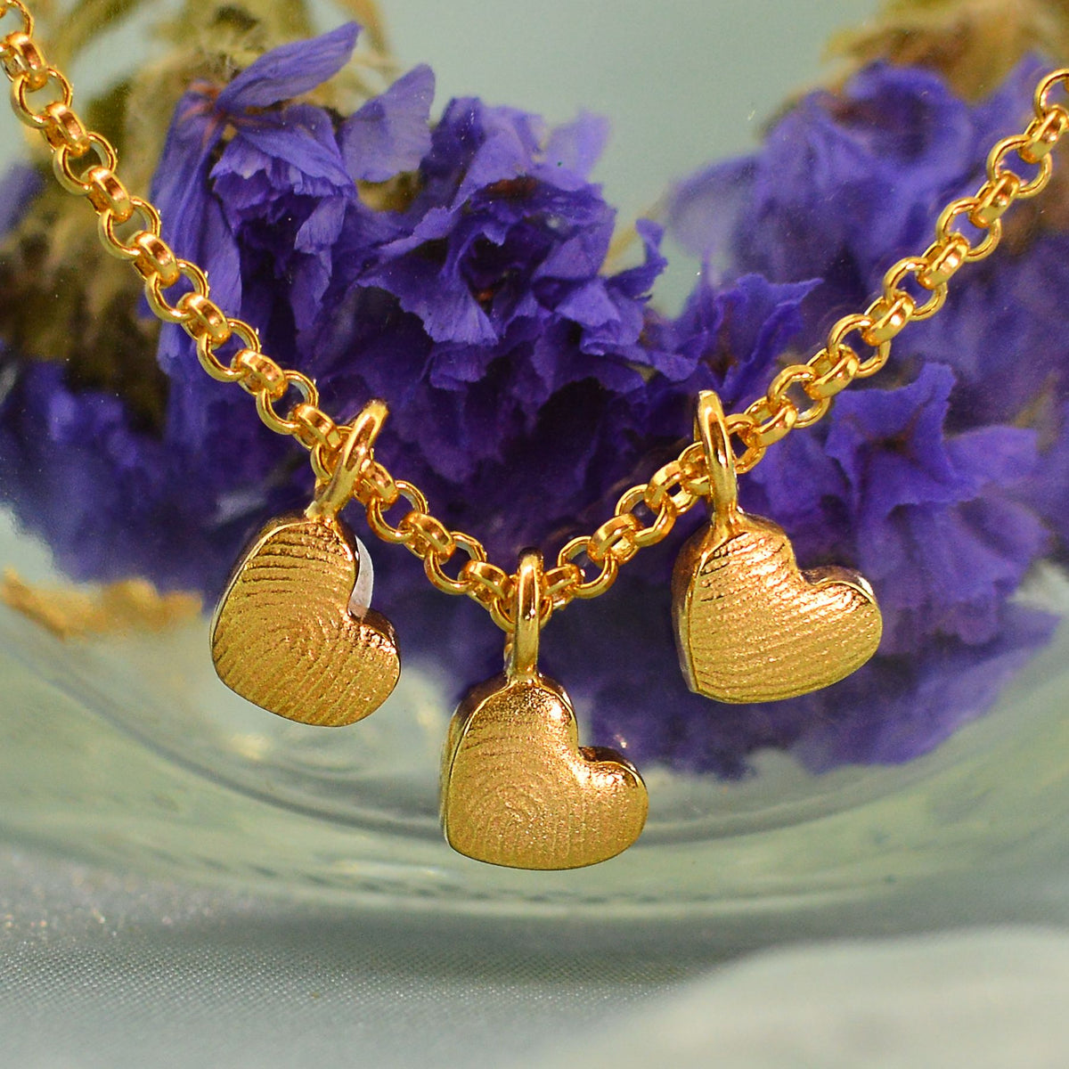 Three Family Dainty Heart Fingerprint Necklaces in solid 18ct gold | Necklace for Mum | Children's Fingerprints | Displayed on an 18ct gold belcher or rolo chain | Custom engraving on reverse | Personalised Necklace | Sophia Alexander Fingerprint Jewellery | Handmade in Suffolk UK