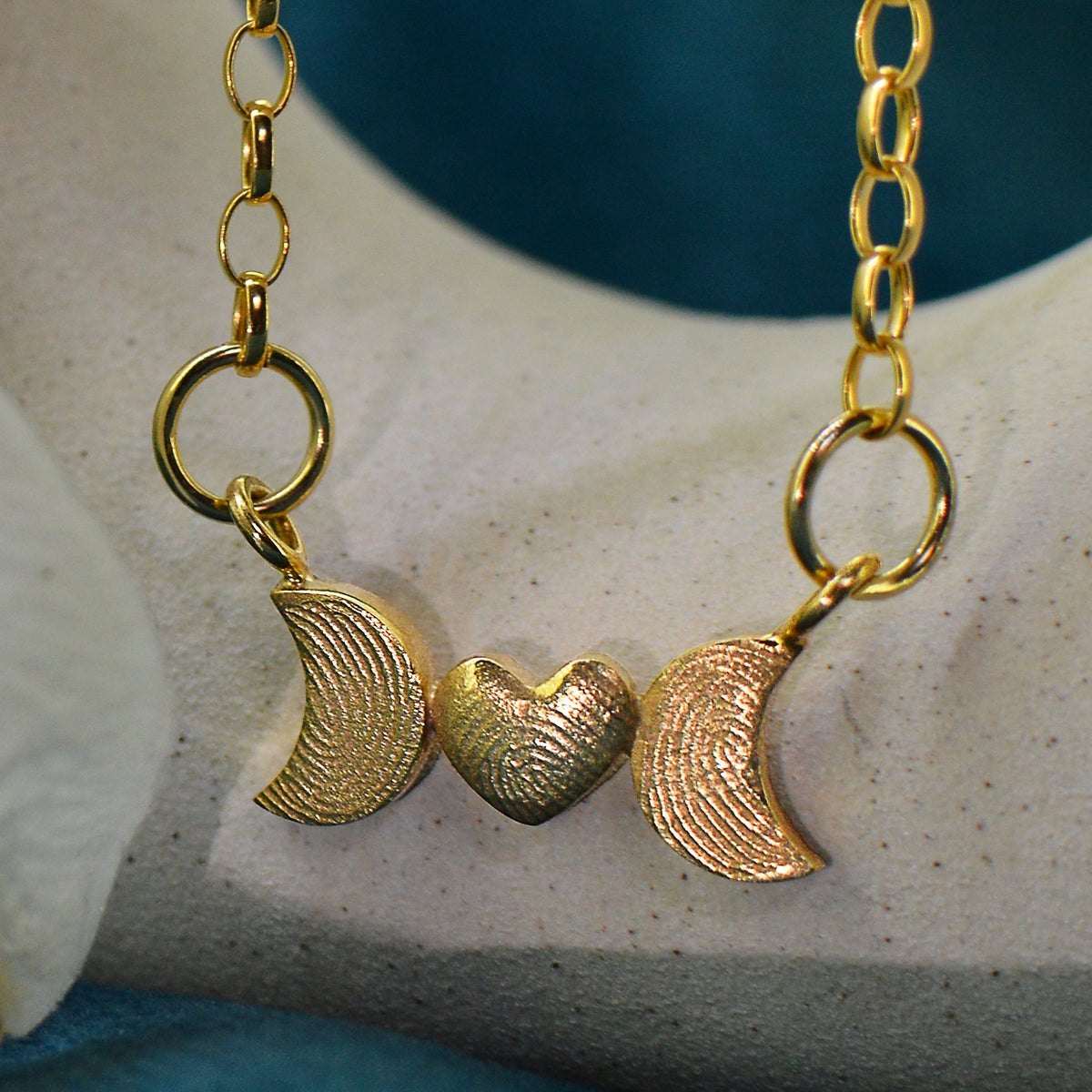 Family Fingerprint Necklace for Mum in solid 18ct gold | Heart and Moon Necklace with fingerprints from three children | Displayed on an 18ct gold belcher or rolo chain | Custom engraving on reverse | Personalised Necklace | Sophia Alexander Fingerprint Jewellery | Handmade in Suffolk UK