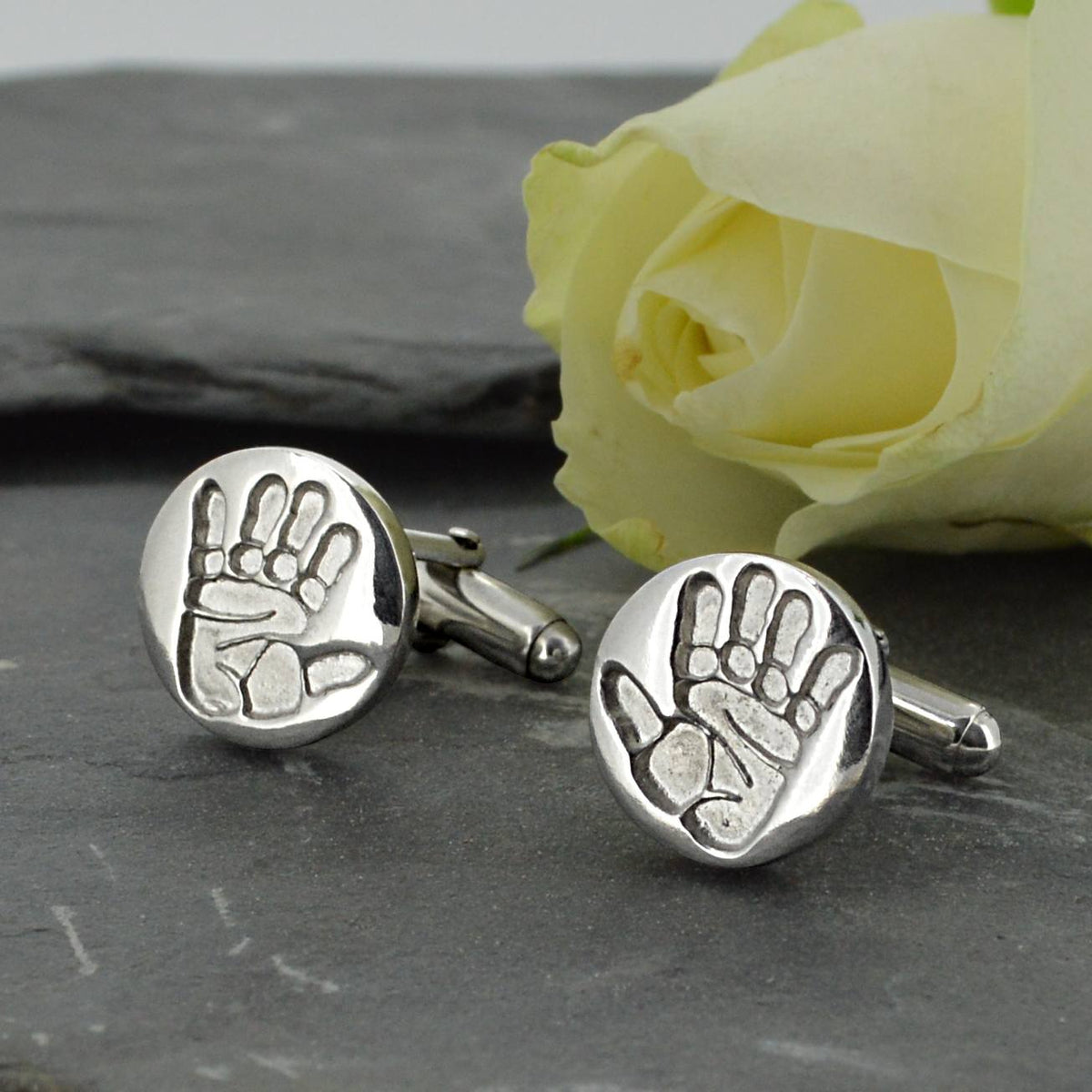 Two disc shaped cufflinks in solid silver with two children's handprints | Adjustable Cufflink backs | Custom Personalised Gift | Sophia Alexander Fingerprint Jewellery | Handmade in Suffolk UK