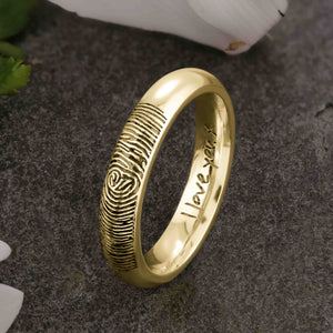 A unique gold Wedding Ring with an engraved fingerprint on the outer surface | Engraved with a handwritten personal message on the inside of the ring | The engraving reads "I love you. x" | Contemporary dark laser engraving | Ladies slim 4mm wide, comfort court profile ring | Custom personalised wedding jewellery | Sophia Alexander Fingerprint Jewellery | Handmade in Suffolk UK