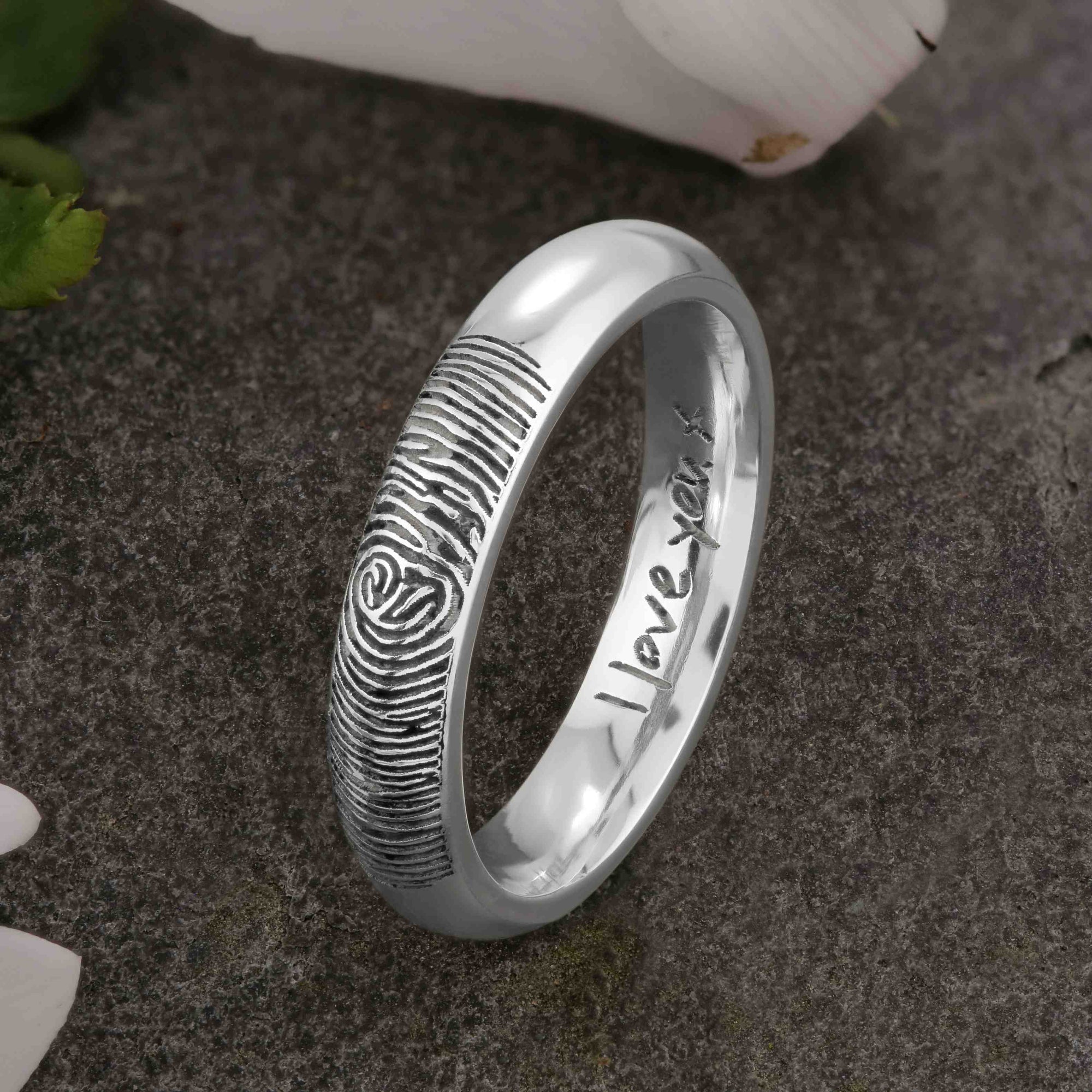 A unique platinum Wedding Ring with an engraved fingerprint on the outer surface | Engraved with a handwritten personal message on the inside of the ring | The engraving reads "I love you. x" | Contemporary dark laser engraving | Ladies slim 4mm wide, comfort court profile ring | Custom personalised wedding jewellery | Sophia Alexander Fingerprint Jewellery | Handmade in Suffolk UK