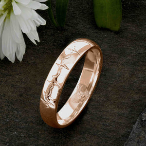 An 18ct Rose Gold Wedding Ring with two fingerprints engraved in the shape of a heart on the inside surface | Engraved with a real heartbeat trace on the outside of the ring | Hand engraving | Ladies slim 4mm wide, comfort court profile ring | Custom personalised wedding jewellery | Sophia Alexander Fingerprint Jewellery | Handmade in Suffolk UK