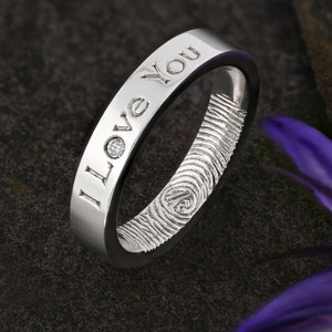 A Platinum Wedding Ring with an engraved fingerprint on the inner surface | Engraved with the words "I Love You" on the outside of the ring | A single diamond set into the "o" of Love | Hand engraving | Ladies slim 4mm wide, comfort flat court profile ring | Custom personalised wedding jewellery | Sophia Alexander Fingerprint Jewellery | Handmade in Suffolk UK