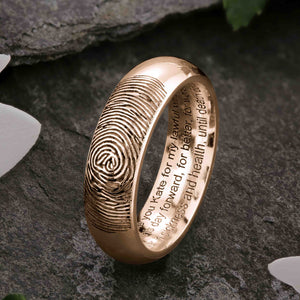 A unique rose Gold Wedding Ring with an engraved fingerprint on the outer surface | Engraved with personalised wedding vows on three lines on the inside of the ring | Contemporary Laser engraving | Mens 6mm wide, comfort court profile ring | Custom personalised wedding jewellery | Sophia Alexander Fingerprint Jewellery | Handmade in Suffolk UK