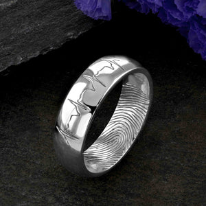 A platinum Wedding Ring with a single fingerprint engraved on the inside surface | Engraved with a real heartbeat trace on the outside of the ring | Hand engraving | Men's 6mm wide, comfort court profile ring | Custom personalised wedding jewellery | Sophia Alexander Fingerprint Jewellery | Handmade in Suffolk UK