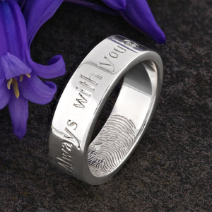 A Platinum Wedding Ring with an engraved fingerprint on the inner surface | Engraved with a sentimental message on the outside of the ring | A single diamond set after the words "Always with you" | Hand engraving | Mens 6mm wide, comfort flat court profile ring | Custom personalised wedding jewellery | Sophia Alexander Fingerprint Jewellery | Handmade in Suffolk UK