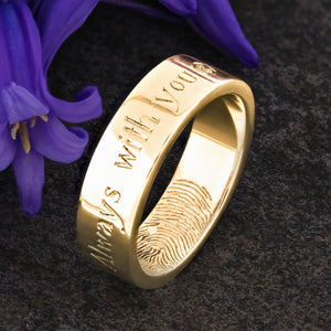 A Gold Wedding Ring with an engraved fingerprint on the inner surface | Engraved with a sentimental message on the outside of the ring | A single diamond set after the words "Always with you" | Hand engraving | Mens 6mm wide, comfort flat court profile ring | Custom personalised wedding jewellery | Sophia Alexander Fingerprint Jewellery | Handmade in Suffolk UK