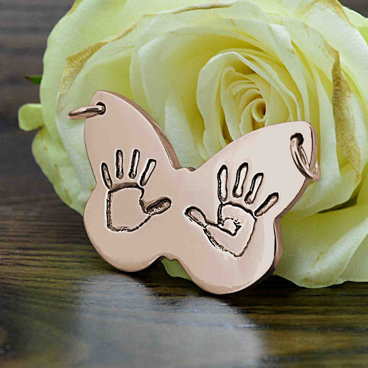 Large butterfly shaped Pendant in rose gold with two children's handprints | Personalised Gift shown on a keyring with a chain | Sophia Alexander Fingerprint Jewellery | Handmade in Suffolk UK