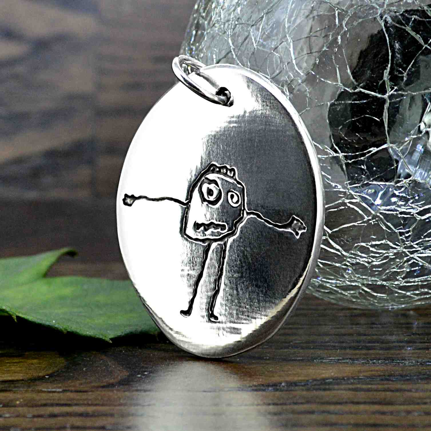 Large oval shaped Pendant in solid silver with a child's real drawing or special picture | Personalised Gift shown on a keyring with a chain | Sophia Alexander Fingerprint Jewellery | Handmade in Suffolk UK
