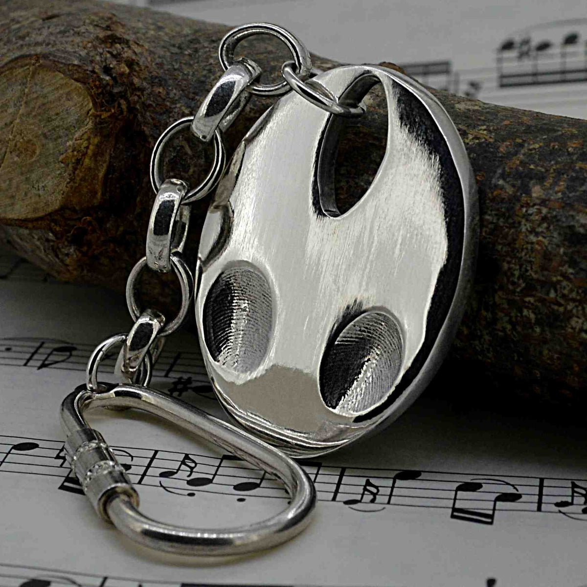 Solid silver oval shaped pendant with two children's fingerprints | Shown on a keyring with a chain | Personalised Gifts | Sophia Alexander Fingerprint Jewellery | Handmade in Suffolk UK