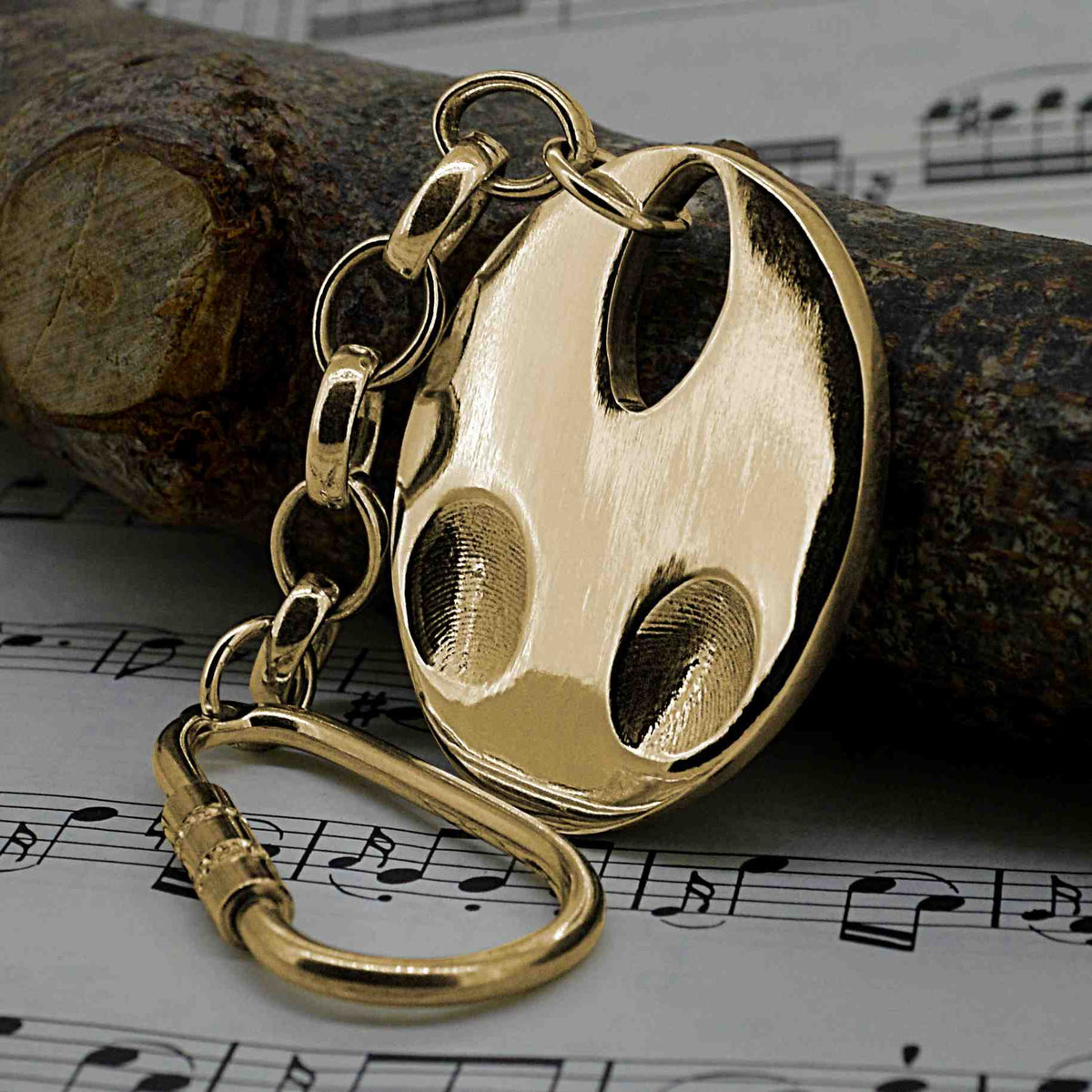 Solid Gold oval shaped pendant with two children's fingerprints | Shown on a keyring with a chain | Personalised Gifts | Sophia Alexander Fingerprint Jewellery | Handmade in Suffolk UK