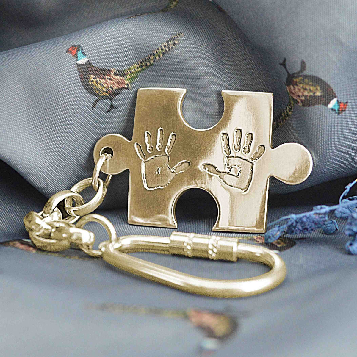 Large puzzle piece shaped Necklace in solid gold with two children's handprints | Personalised Gift | Sophia Alexander Fingerprint Jewellery | Handmade in Suffolk UK