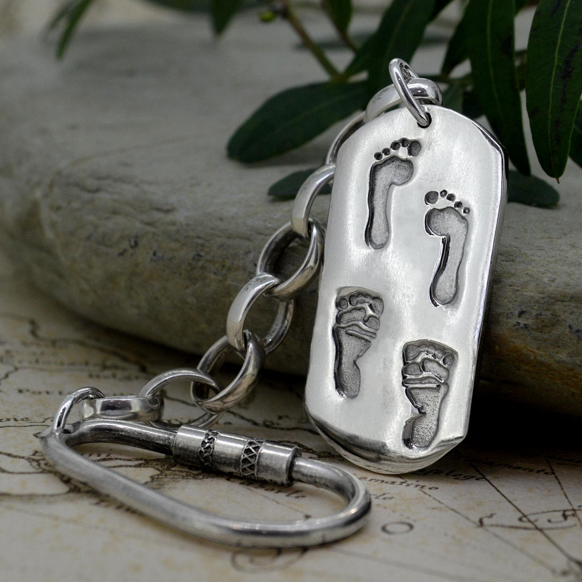 Large dog tag style pendant in solid silver with real baby Footprints | Shown on a Keyring with a chain | Personalised Necklace | Sophia Alexander Fingerprint Jewellery | Handmade in Suffolk UK